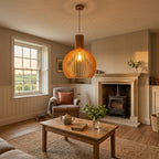 Aspen wooden lampshade hanging above a table in a living room of a British home