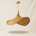 Elva handwoven wicker pendant lampshade on a neutral background