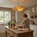 Kaia bamboo lampshade shown above a dining table in a British home


