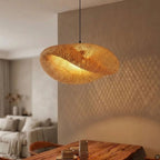 Kaia bamboo lampshade glowing warmly, casting soft shadows