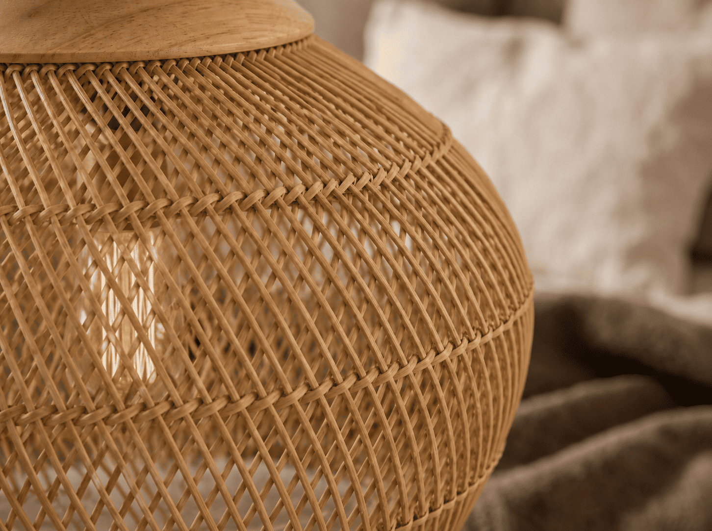Close-up of handwoven natural wicker texture, showing the craftsmanship behind Maison Halo