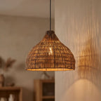 Maren wicker lampshade lit, glowing softly through the weave