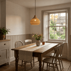 Mira boho wicker lampshade hanging in a cosy British dining room