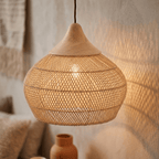 Mira wicker lampshade lit, casting a soft warm halo