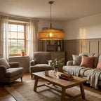 Rowan wooden lampshade hanging above a living room in a British home