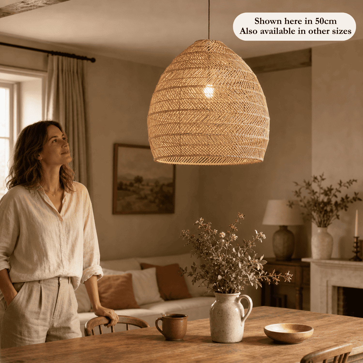 Sena wicker lampshade in 50cm shown above a dining table in a British home