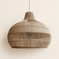 Vera handwoven rattan pendant lampshade on a neutral background