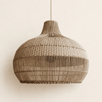 Vera handwoven rattan pendant lampshade on a neutral background